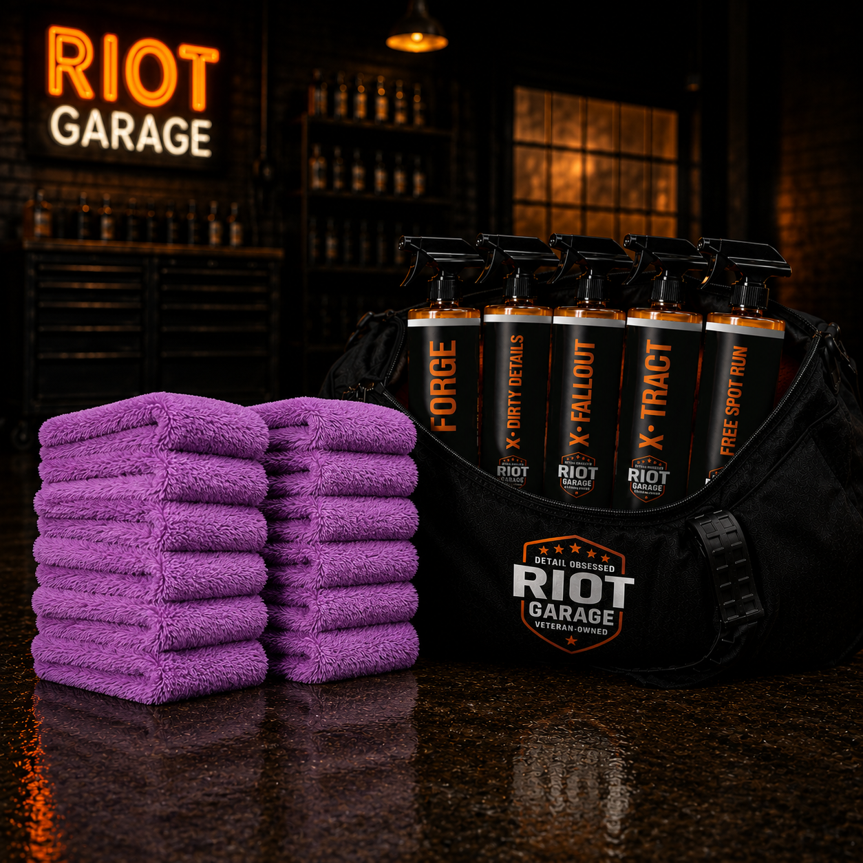 RECON — multiple stacks of 16x16 ultra plush finishing towels in front of the Riot Garage duffel bag
